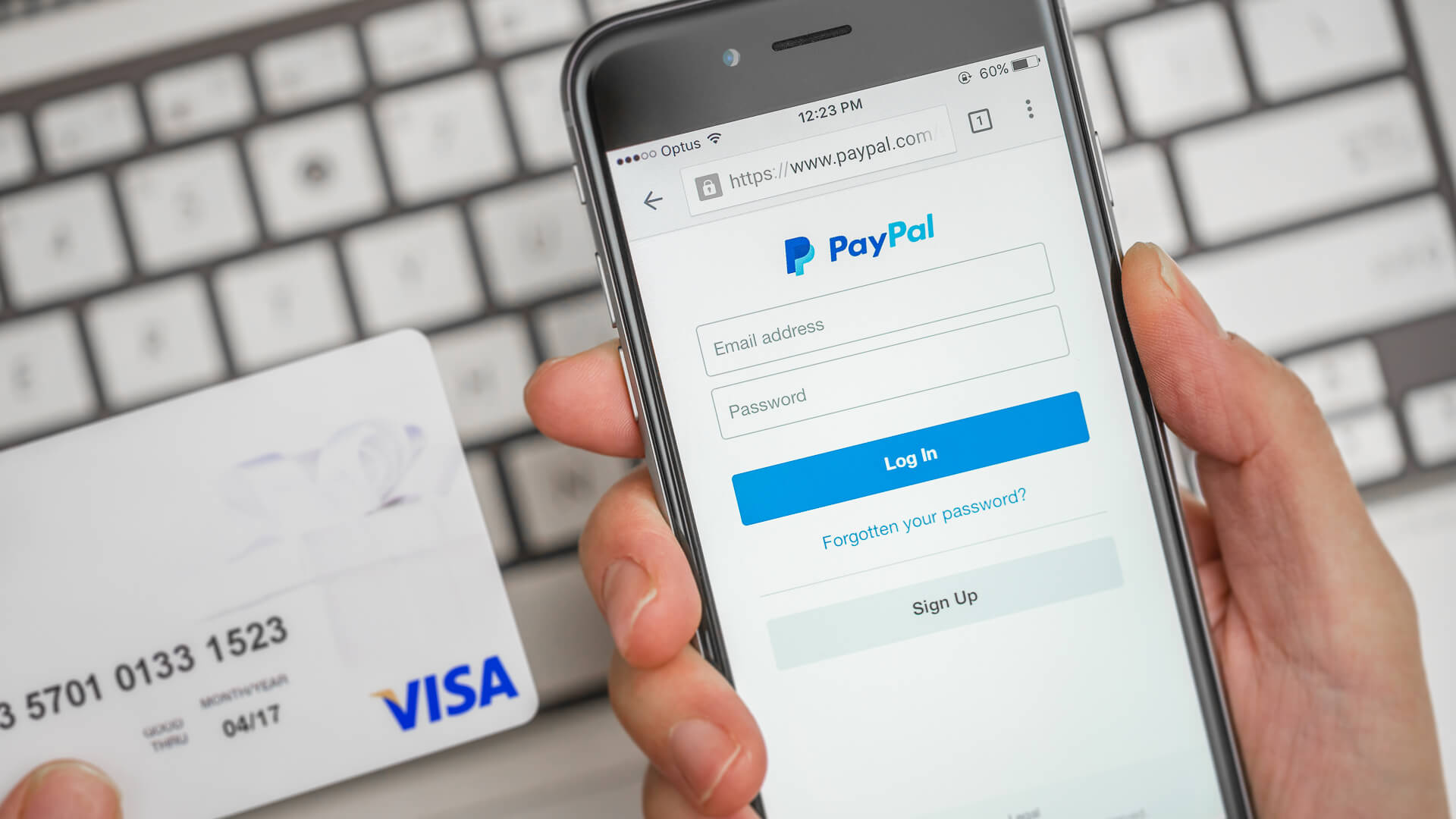 person using paypal on their smart phone