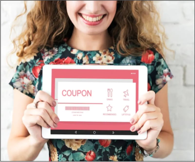 Woman holding a coupon