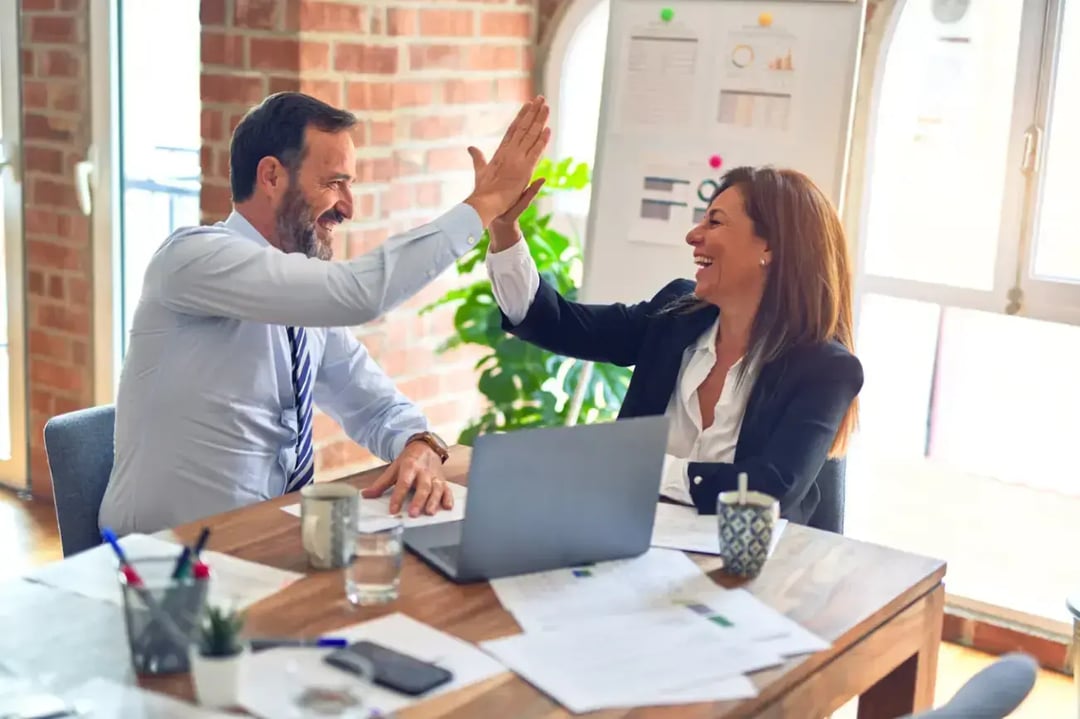 businesspeople-high-fiving-each-other