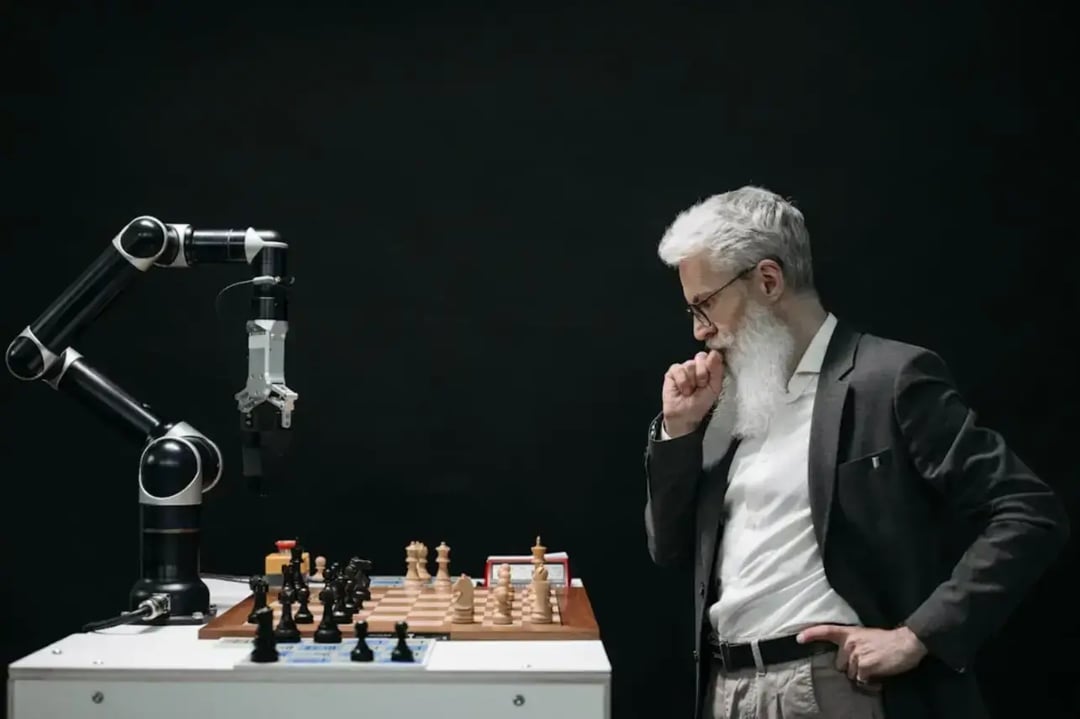 elderly-man-playing-chess-with-robot