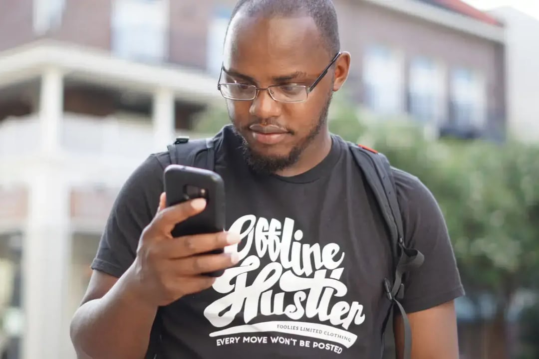 man-looking-at-phone-screen