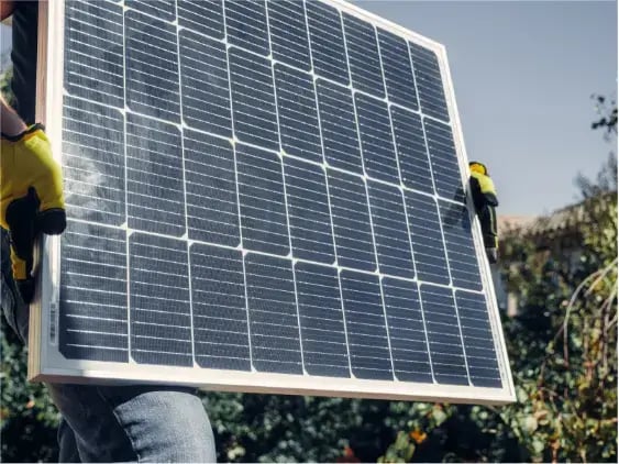 person-holding-solar-panel