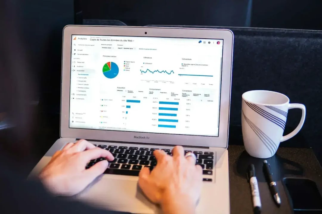 person-using-macbook-pro-on-black-table