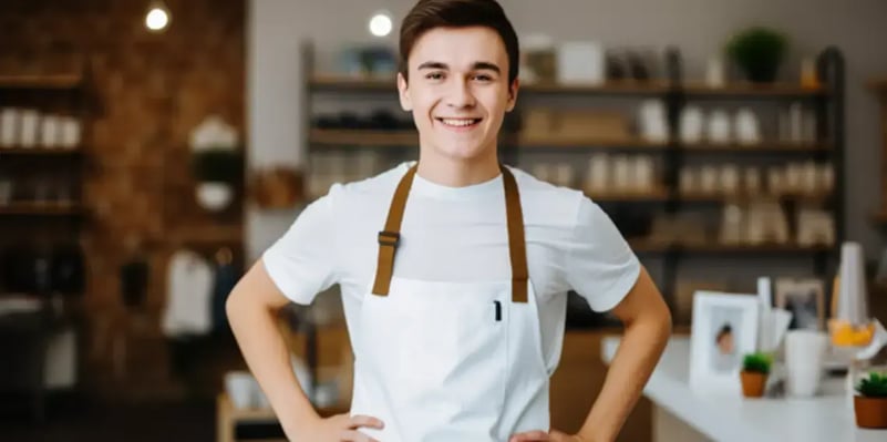 smiling-young-chef-in-a-shop-or-restaurant