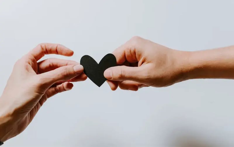 two-hands-holding-paper-heart-1