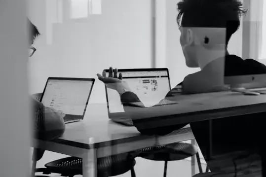 two-men-working-on-laptops
