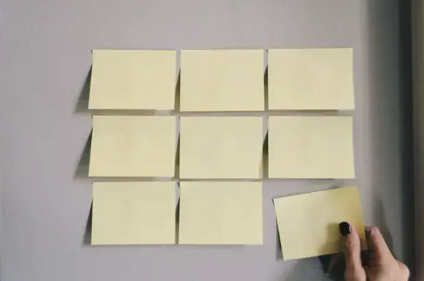 person-applying-sticky-notes